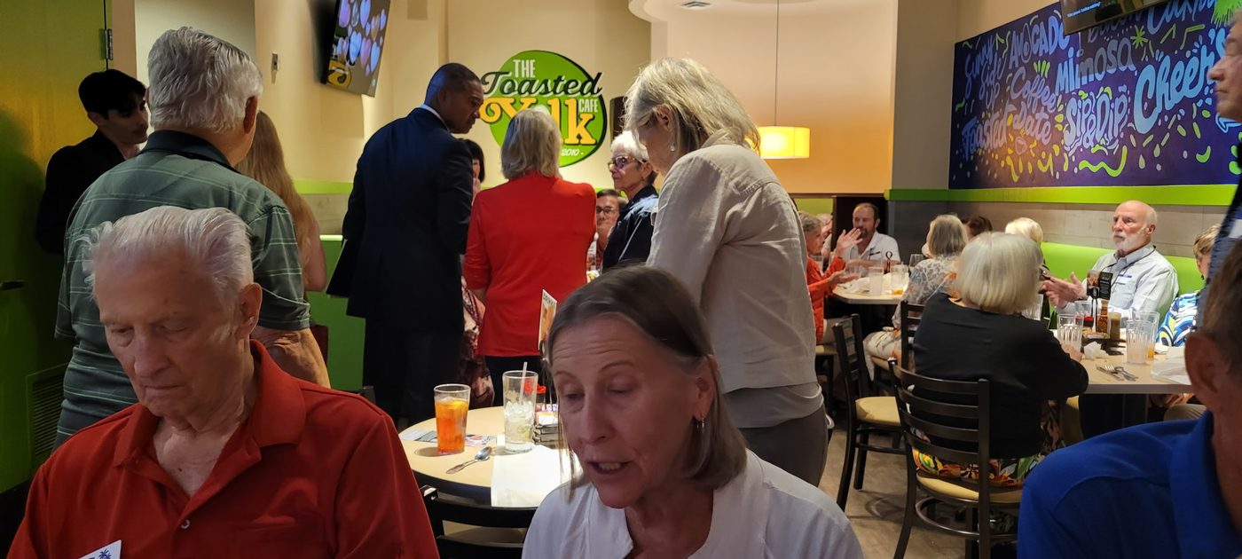 Packed community gathering at a local restaurant with Victor Arias and supporters