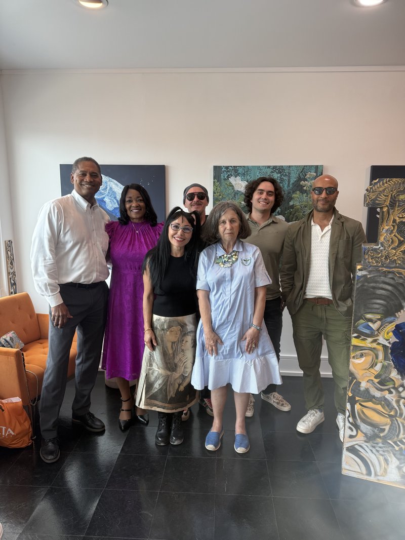 Victor Arias with artist Maria Pua and community members at a local art exhibition in Southwest Florida